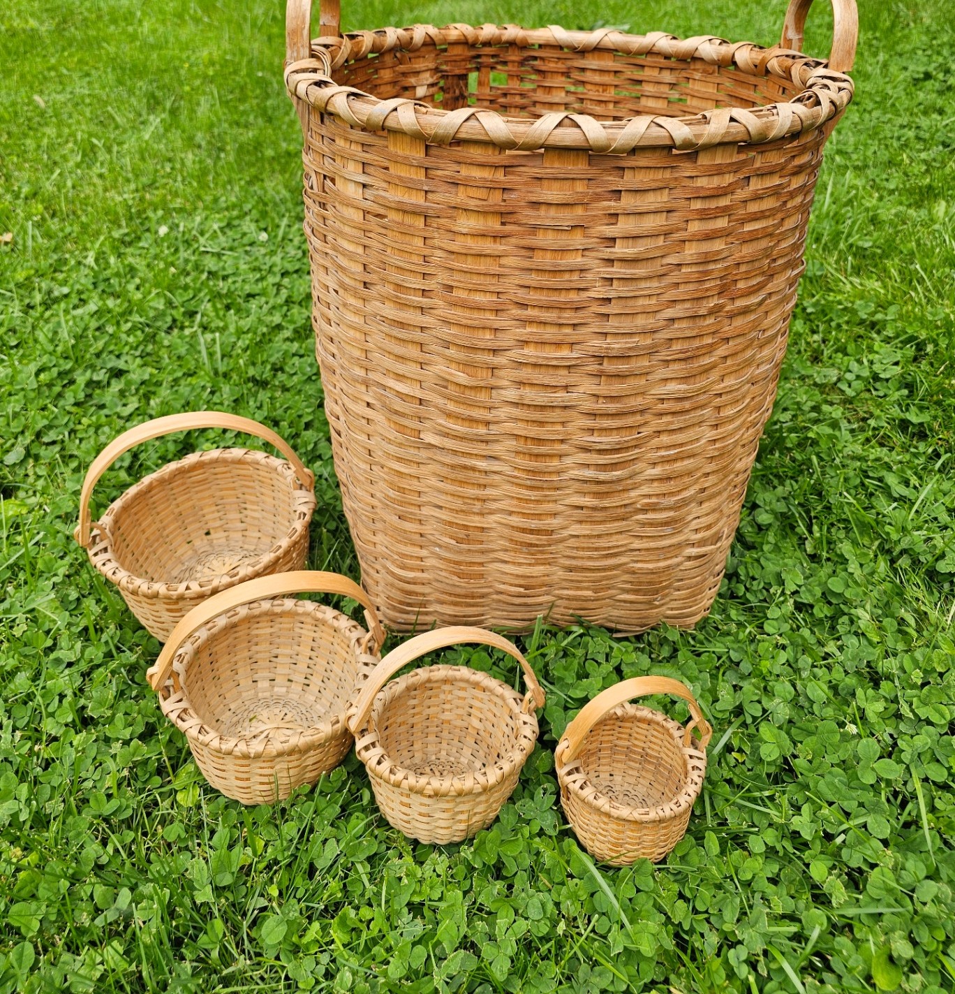 A grouping of Taghkanic ash splint baskets in different shapes and sizes.